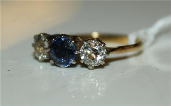 Sapphire and diamond three-stone ring, yellow metal setting